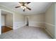 Dining area features tile flooring, a ceiling fan, neutral walls and seamless transition to other spaces at 87 Virgil Sw St, Mableton, GA 30126