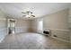 Bright dining area featuring neutral walls, tile flooring, a ceiling fan, and access to adjacent rooms at 87 Virgil Sw St, Mableton, GA 30126