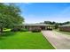 Charming single-story brick home with a well-manicured lawn and an attached covered carport at 87 Virgil Sw St, Mableton, GA 30126