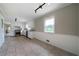 Open concept kitchen with white cabinets, stainless steel appliances, granite countertops, and tile floors at 87 Virgil Sw St, Mableton, GA 30126