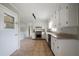 Open concept kitchen with white cabinets, stainless steel appliances, granite countertops, and tile floors at 87 Virgil Sw St, Mableton, GA 30126