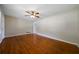 Spacious living room with gleaming hardwood floors, ceiling fan, and neutral paint at 87 Virgil Sw St, Mableton, GA 30126