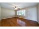 Inviting living room with hardwood floors, a ceiling fan, a front door, and natural light at 87 Virgil Sw St, Mableton, GA 30126