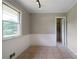 The room has beadboard wainscoting and neutral paint, plus a tile floor and a door to the closet at 87 Virgil Sw St, Mableton, GA 30126
