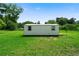 Backyard shed with windows and a lawn at 87 Virgil Sw St, Mableton, GA 30126