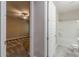 A view from a bedroom through a doorway to a bathroom with a shower and toilet at 150 Whitworth Dr, Locust Grove, GA 30248