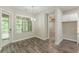 A bright dining area with hardwood floors, lots of light, and backyard access at 150 Whitworth Dr, Locust Grove, GA 30248
