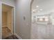 Hallway view leading to an open-concept kitchen with white cabinetry and an island at 150 Whitworth Dr, Locust Grove, GA 30248
