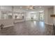 Large open-concept living room featuring hardwood floors and access to the kitchen and dining area at 150 Whitworth Dr, Locust Grove, GA 30248