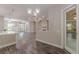 Open-concept living room features hardwood flooring and plentiful natural light at 150 Whitworth Dr, Locust Grove, GA 30248