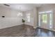 Bright living room with stylish wood floors and wainscoting, illuminated by natural light and a modern chandelier at 150 Whitworth Dr, Locust Grove, GA 30248