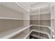 Walk-in pantry with custom shelving to provide ample storage space at 150 Whitworth Dr, Locust Grove, GA 30248
