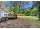 Expansive backyard featuring a wooden deck and lush green lawn at 1879 Rosewood Rd, Decatur, GA 30032