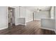 Spacious open-concept living area with new hardwood flooring and neutral walls leading into other rooms at 1879 Rosewood Rd, Decatur, GA 30032