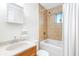 Cozy bathroom features a shower-tub combo with tile surround and natural light from a small window at 228 Olympic Pl # 47, Decatur, GA 30030