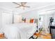 Spacious bedroom features hardwood floors, ceiling fan, and a mirrored closet, offering ample storage space at 228 Olympic Pl # 47, Decatur, GA 30030