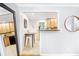 Open kitchen pass-through with views to the dining and living areas, featuring granite counters and wood cabinets at 228 Olympic Pl # 47, Decatur, GA 30030