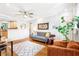 Inviting living room features hardwood floors, neutral walls, ceiling fan, and modern furnishings creating a cozy and stylish atmosphere at 228 Olympic Pl # 47, Decatur, GA 30030