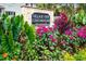 Entrance to Village View Condominiums with lush landscaping and colorful flowers around the community sign at 228 Olympic Pl # 47, Decatur, GA 30030