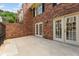 Brick patio with access to the house through 2 sets of glass paneled double doors at 27 Jefferson Hill Ne Pl, Atlanta, GA 30342