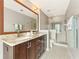Bathroom with granite countertops, double sinks, a large mirror, and a separate glass shower at 27 Jefferson Hill Ne Pl, Atlanta, GA 30342