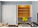 Bedroom with a built-in desk area, a closet and hardwood floors at 27 Jefferson Hill Ne Pl, Atlanta, GA 30342