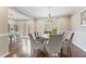 Elegant dining room featuring a modern chandelier and gray upholstered chairs and view of the kitchen at 27 Jefferson Hill Ne Pl, Atlanta, GA 30342