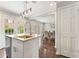 Open kitchen featuring an island, pendant lighting, stainless steel appliances, and seamless flow to the dining area at 27 Jefferson Hill Ne Pl, Atlanta, GA 30342