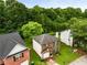 Aerial view of the house showing the lawn, landscaping, and surrounding greenery at 3949 Riverside Pkwy, Decatur, GA 30034