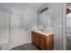 Nicely-lit bathroom with tub-shower and wood vanity at 3949 Riverside Pkwy, Decatur, GA 30034