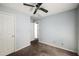 This carpeted bedroom features a ceiling fan, closet, and neutral wall color at 3949 Riverside Pkwy, Decatur, GA 30034