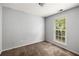 Well-lit bedroom with neutral walls and a large window at 3949 Riverside Pkwy, Decatur, GA 30034