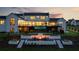 The backyard features a cozy fire pit and an elevated deck with an infinity pool at 5160 Howard A Rd, Cumming, GA 30040