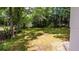 Backyard featuring large grassy area with mature trees at 8420 Sheridan Dr, Jonesboro, GA 30236