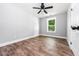 Bedroom featuring hardwood floors, a ceiling fan, and one window at 8420 Sheridan Dr, Jonesboro, GA 30236