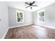 Bright bedroom with two windows and hardwood floors at 8420 Sheridan Dr, Jonesboro, GA 30236