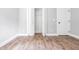 Bright bedroom featuring wood floors, closet, and fresh paint at 8420 Sheridan Dr, Jonesboro, GA 30236