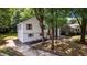 Eye-catching home with fresh exterior paint, lovely landscaping, walkway, and inviting entry stairs at 8420 Sheridan Dr, Jonesboro, GA 30236