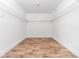 Walk-in closet with wood floor, white walls and shelving at 8420 Sheridan Dr, Jonesboro, GA 30236