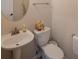 Bright half bathroom with a pedestal sink at 961 Pierce Ivy Ct, Lawrenceville, GA 30043