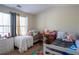 Bright bedroom with twin beds, playful decor, and ample natural light at 961 Pierce Ivy Ct, Lawrenceville, GA 30043