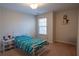 Cozy bedroom with a comfortable bed, natural light, and carpeted floors at 961 Pierce Ivy Ct, Lawrenceville, GA 30043