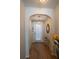 Welcoming entryway with wood floors and an archway to the back door at 961 Pierce Ivy Ct, Lawrenceville, GA 30043