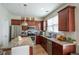 Open-concept kitchen featuring stainless steel appliances and granite countertops at 961 Pierce Ivy Ct, Lawrenceville, GA 30043