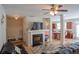 Comfortable living room with hardwood floors, a fireplace, and access to the kitchen at 961 Pierce Ivy Ct, Lawrenceville, GA 30043
