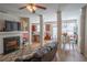 Open-concept space featuring a fireplace, a kitchen and a dining room at 961 Pierce Ivy Ct, Lawrenceville, GA 30043