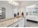 Well-lit bathroom with granite countertops and an ensuite main bedroom at 10 Perimeter Summit Ne Blvd # 4243, Brookhaven, GA 30319