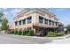 Upscale two-story commercial building featuring awnings, brick accents, and manicured landscaping along a city street at 10 Perimeter Summit Ne Blvd # 4243, Brookhaven, GA 30319