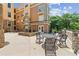 A beautiful outdoor courtyard with tables, seating, a fountain, and attractive landscaping at 10 Perimeter Summit Ne Blvd # 4243, Brookhaven, GA 30319