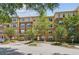 Exterior view of building showing parking, landscaping, trees, and facade at 10 Perimeter Summit Ne Blvd # 4243, Brookhaven, GA 30319
